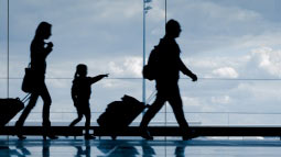 Allianz - family walking in airport