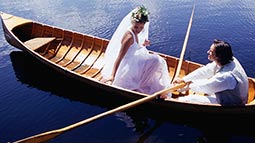 bride and groom on canoe