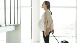 pregnant lady with suitcase