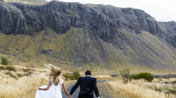Couple Running Towards Mountains