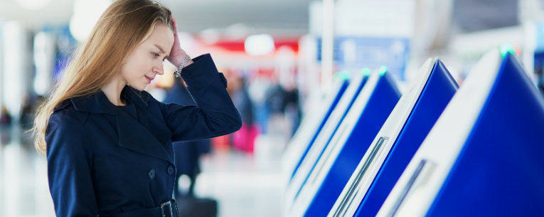 Lady Having Trouble with Airport Ticket Booth