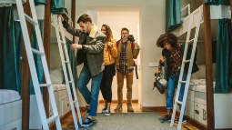 thumbnail image of young people in a hostel bedroom