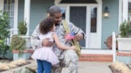 young girl and military father