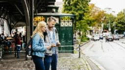 couple looking up directions on smartphone