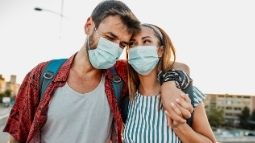 infinite avion travel insurance covid couple wearing masks
