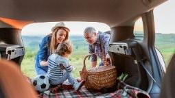 family loading car for a trip