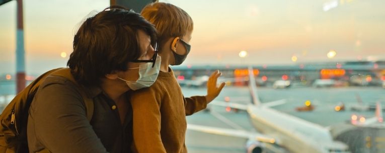 Allianz - Father and son at airport wearing masks