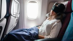 traveler sleeping on flight