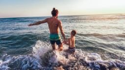 father and son at the beach