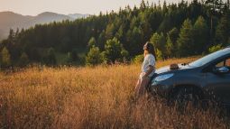 traveler enjoying sunset in the mountains